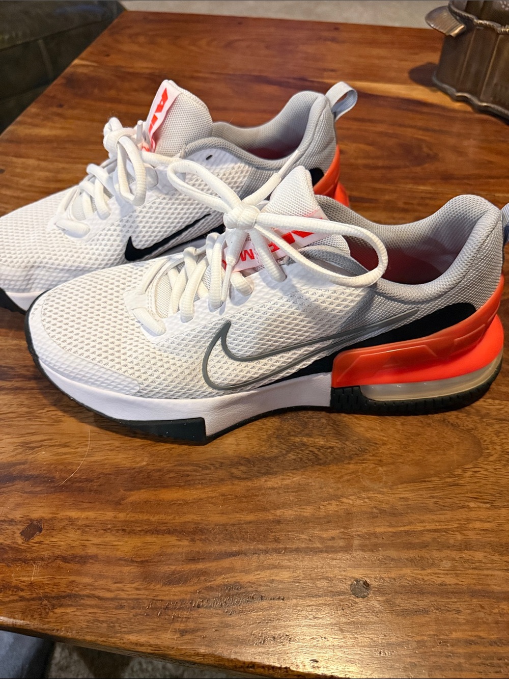 Nike  White Sneakers with Orange Heel Accents